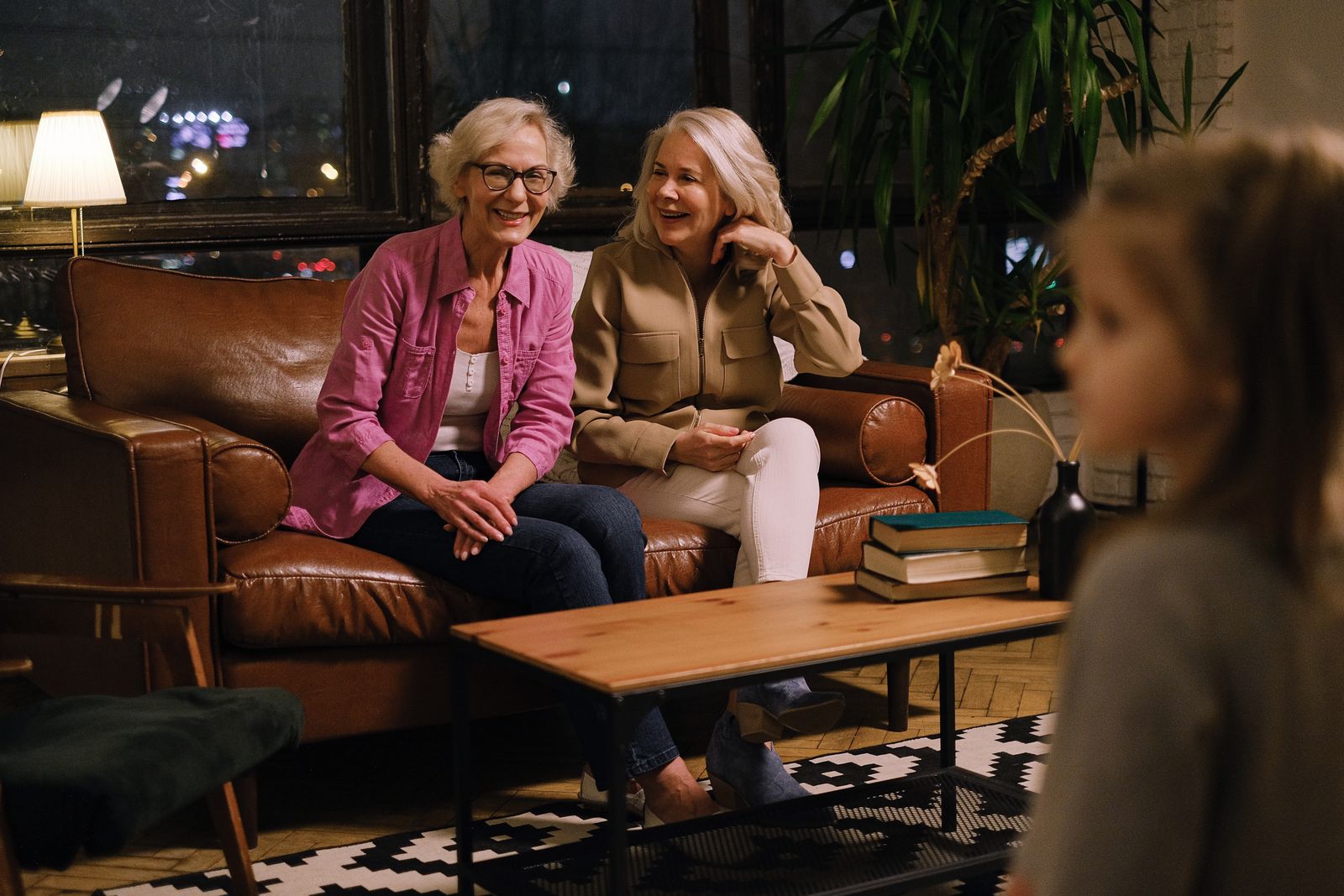 Seniors sharing a lively conversation at home in Cairo, GA