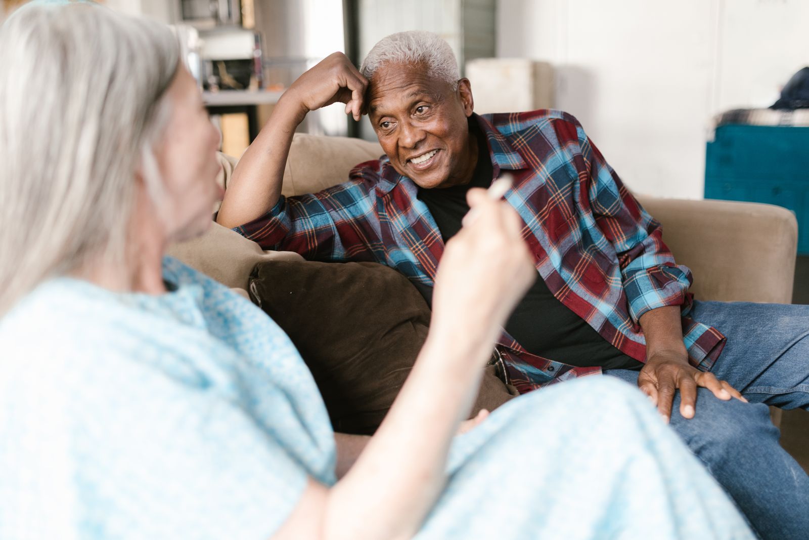 Senior enjoying a relaxed conversation at home in Cairo, GA