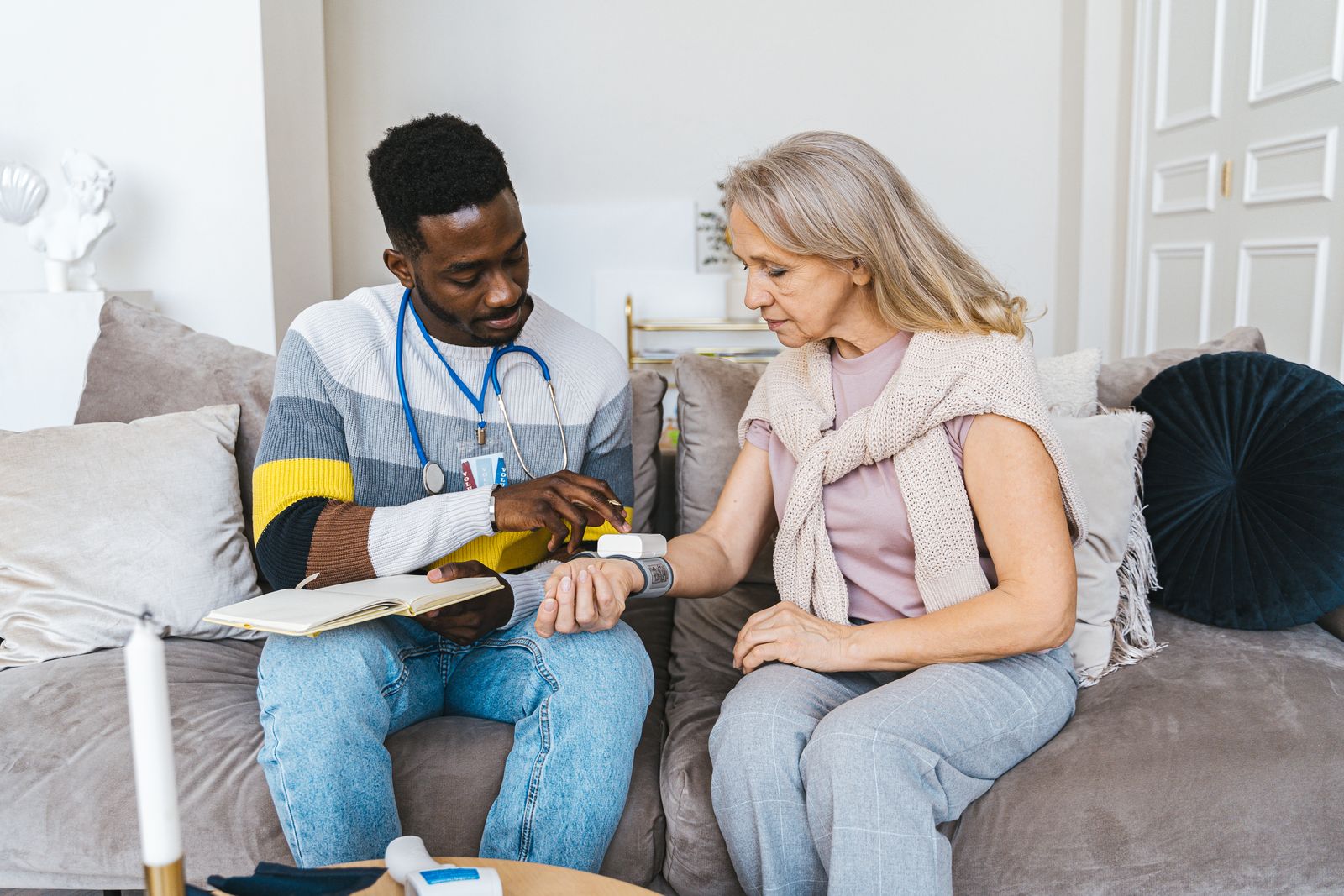 Home health nurse providing a check-up for a senior at home in Cairo, GA
