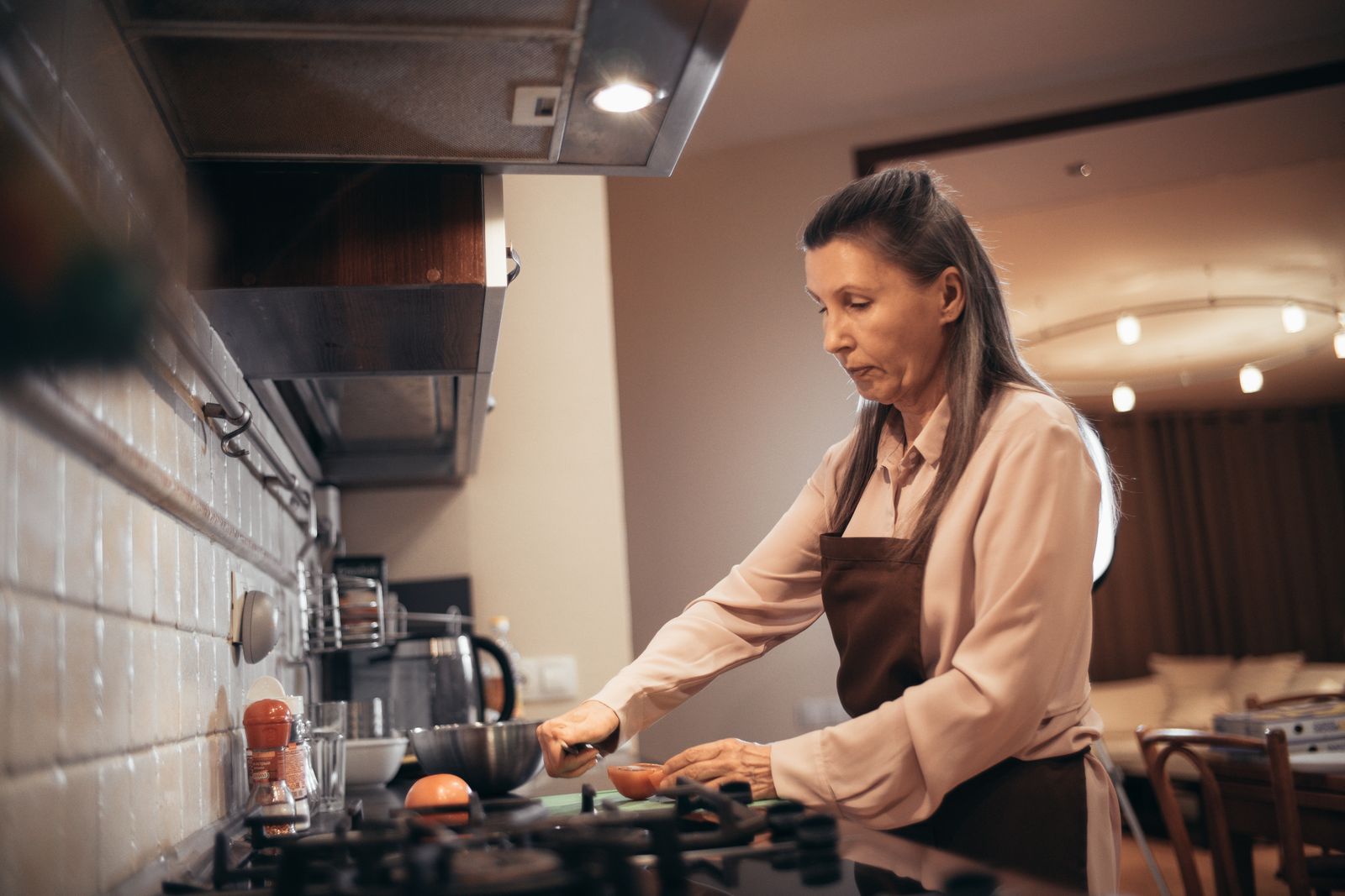 Senior preparing a home-cooked meal with home help in Cairo, GA